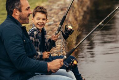father and son sitting and fishing